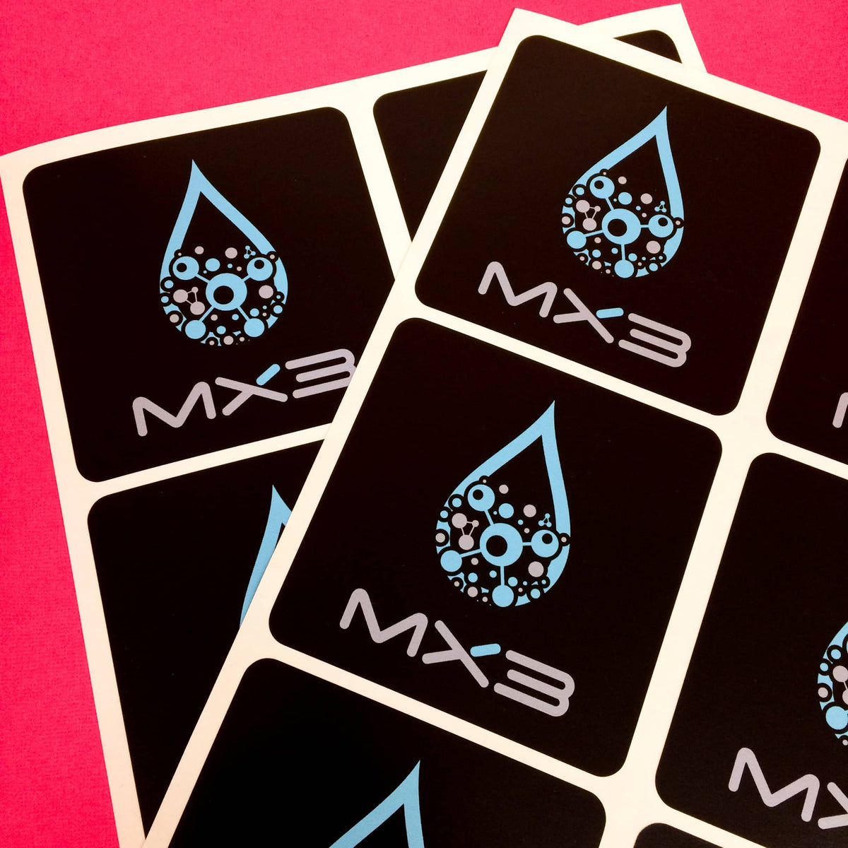 MX3 logo with black background square sheet label stickers.