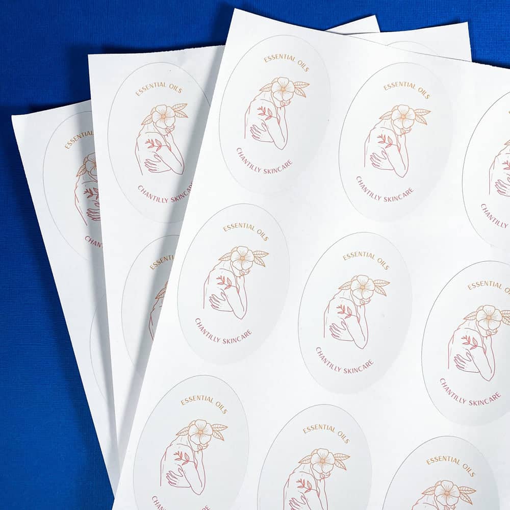 Essential oils business logo on oval sheet labels.