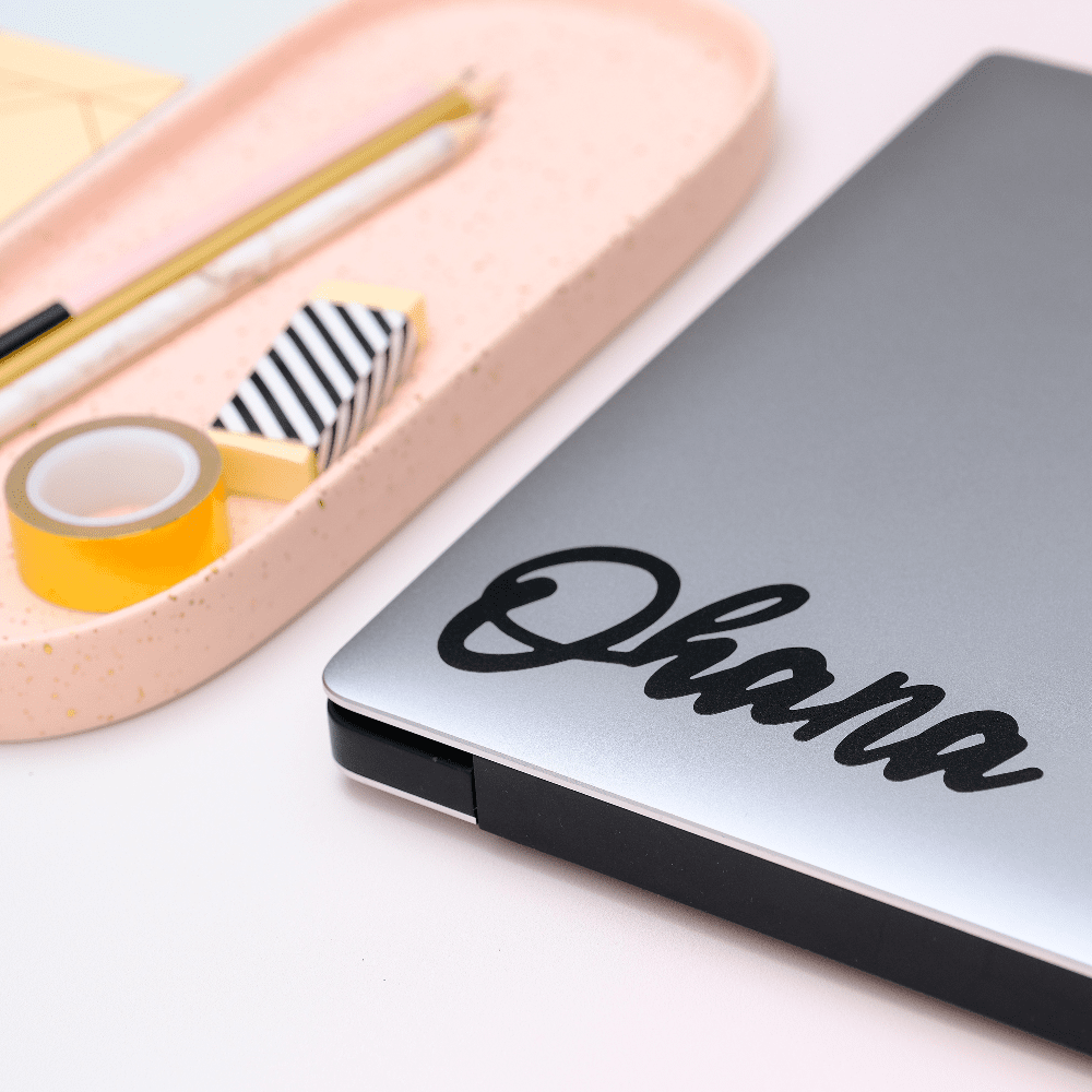 Black &quot;Ohana&quot; decals on a laptop. 